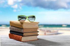  Image of books stacked on a beach